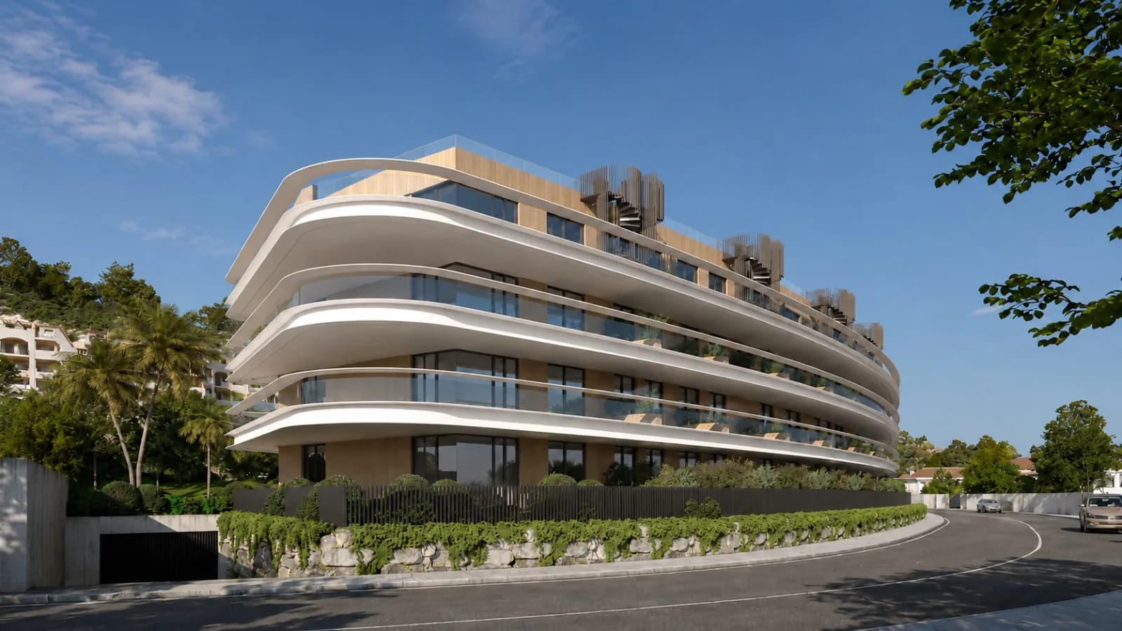 Façade courbe de Moon 64 avec terrasses filantes, vue depuis la rue